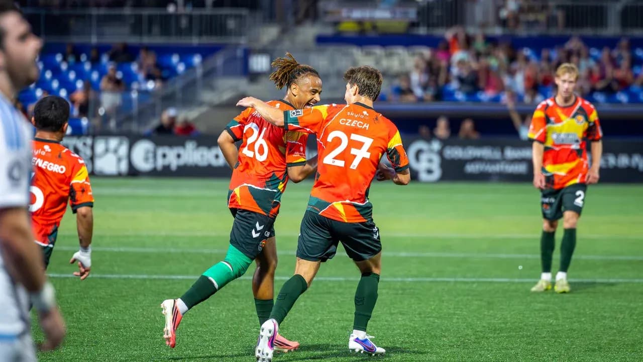 Players celebrating a goal during the match Players celebrating a goal during the match