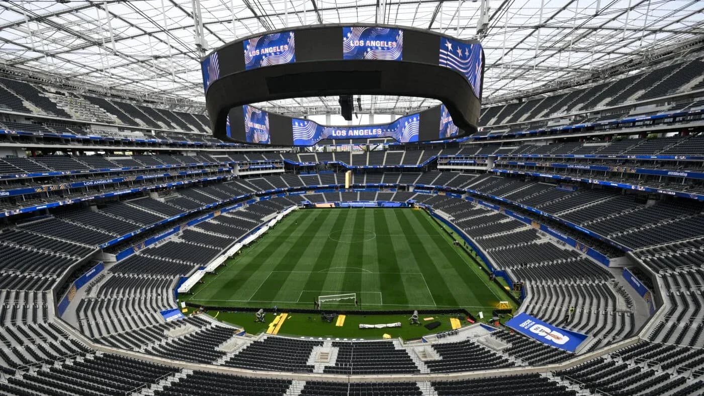 Empty stadium view with field and large screens Empty stadium view with field and large screens