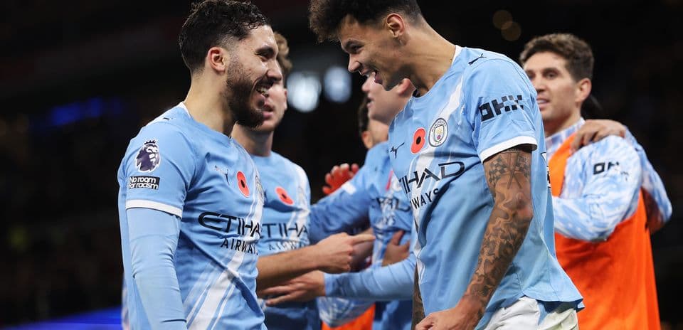 Manchester City players celebrating a goal Manchester City players celebrating a goal