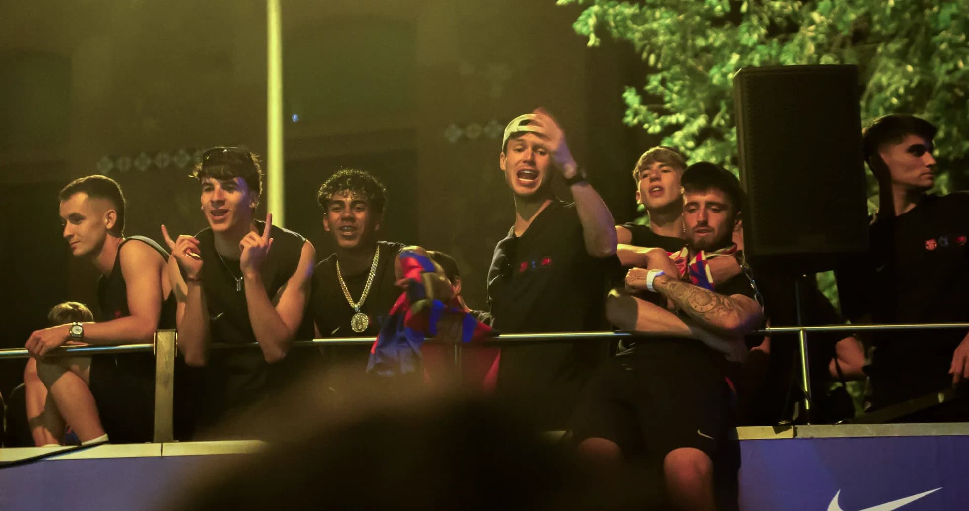 Group of fans celebrating on a balcony Group of fans celebrating on a balcony