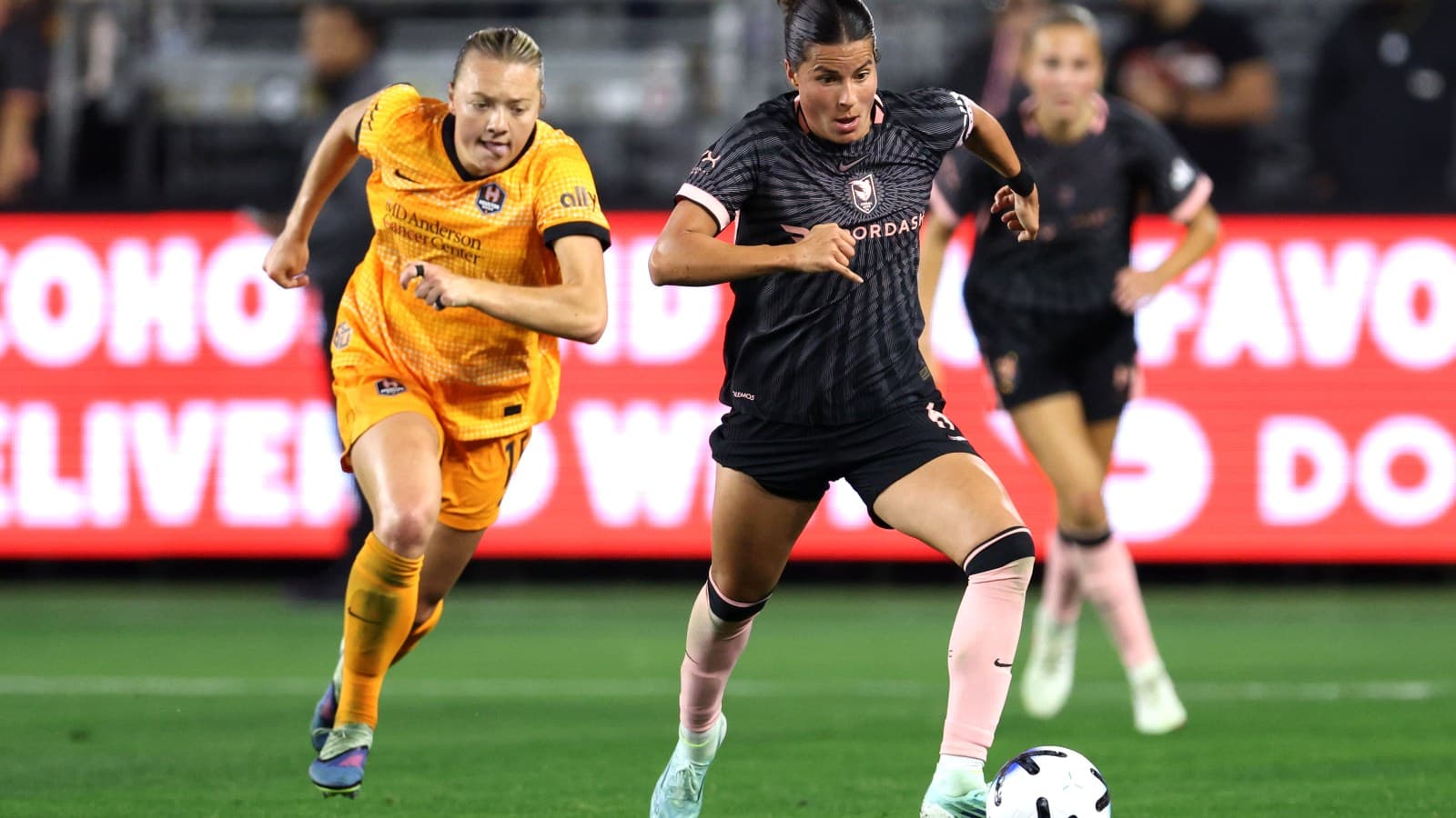 Two players competing in NWSL match Two players competing in NWSL match