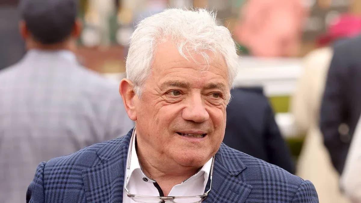 Man with white hair in a checkered blazer Man with white hair in a checkered blazer
