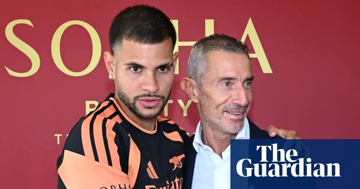 Player and manager posing together at press event Player and manager posing together at press event