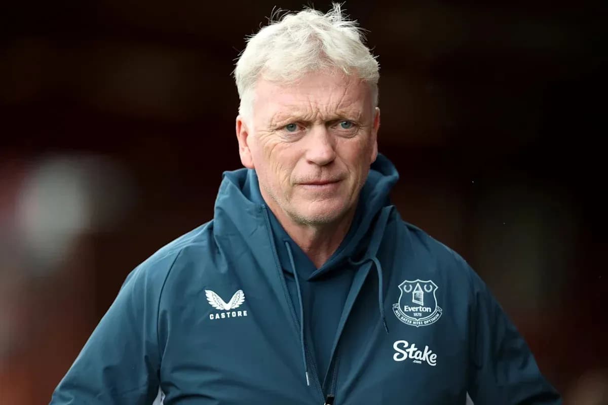 Manager wearing Everton jacket on the pitch Manager wearing Everton jacket on the pitch
