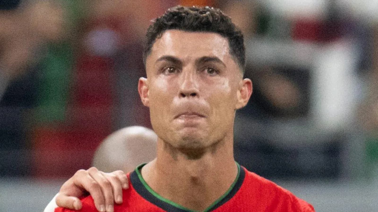 Player in red jersey during match celebration Player in red jersey during match celebration