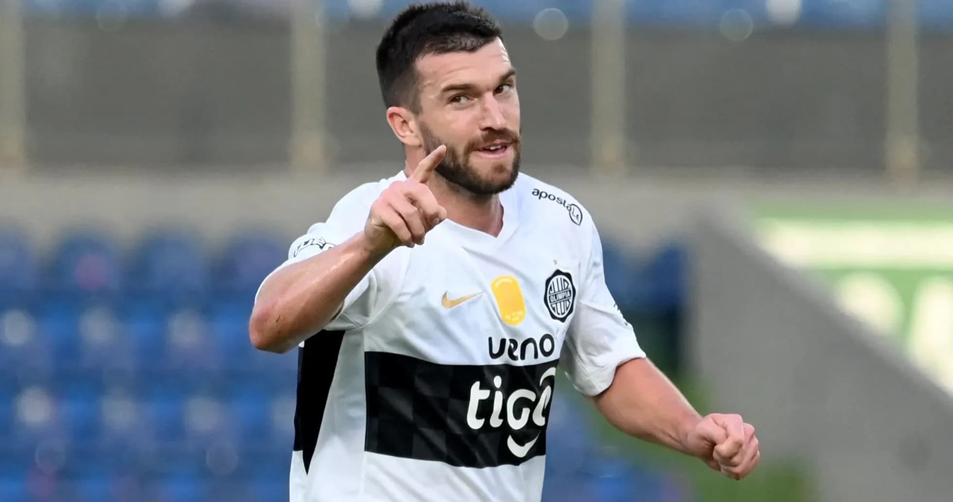 Player celebrating with finger raised during match Player celebrating with finger raised during match