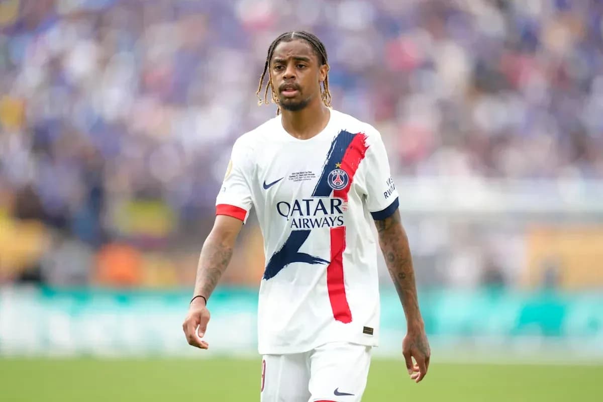 Player in PSG jersey walking on the field Player in PSG jersey walking on the field