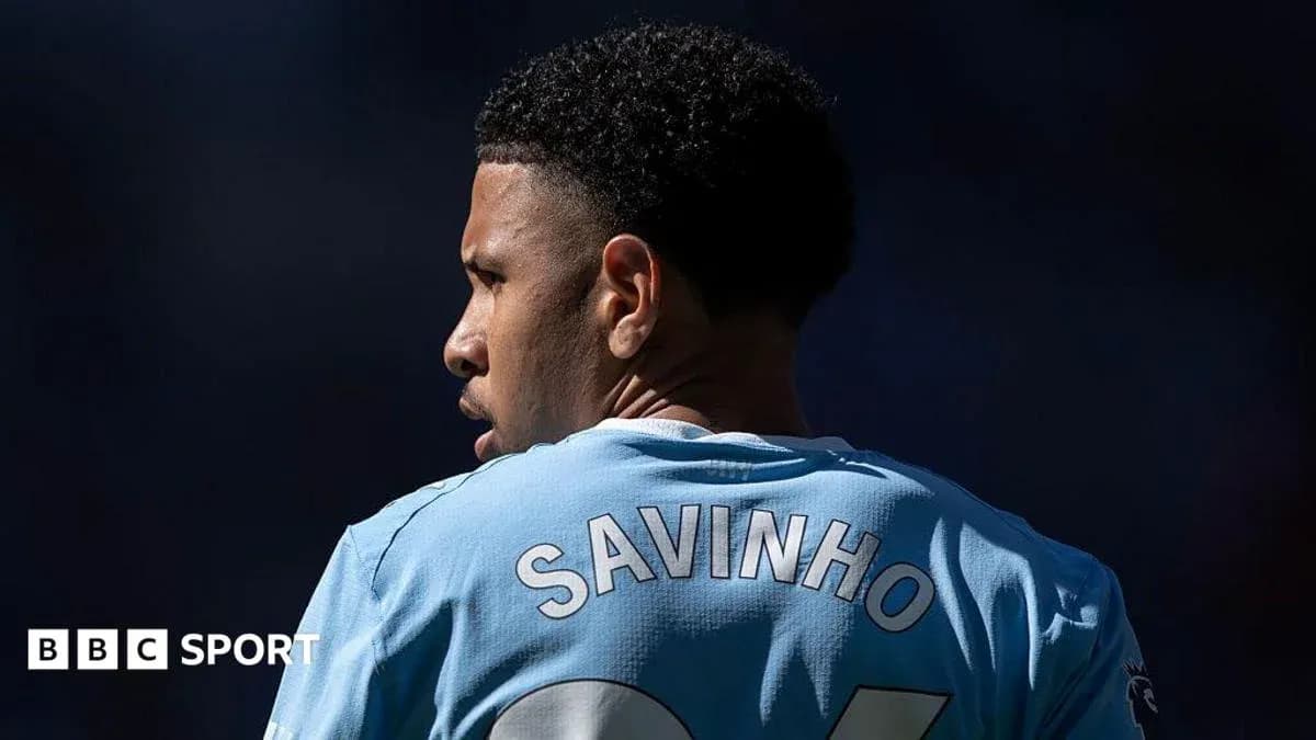 Player in light blue jersey with 'SAVINHO' on back Player in light blue jersey with 'SAVINHO' on back