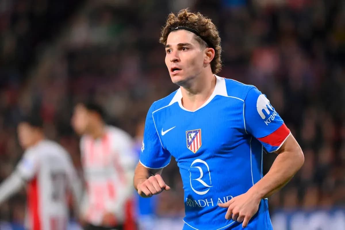 Player in blue Atletico Madrid kit during match Player in blue Atletico Madrid kit during match