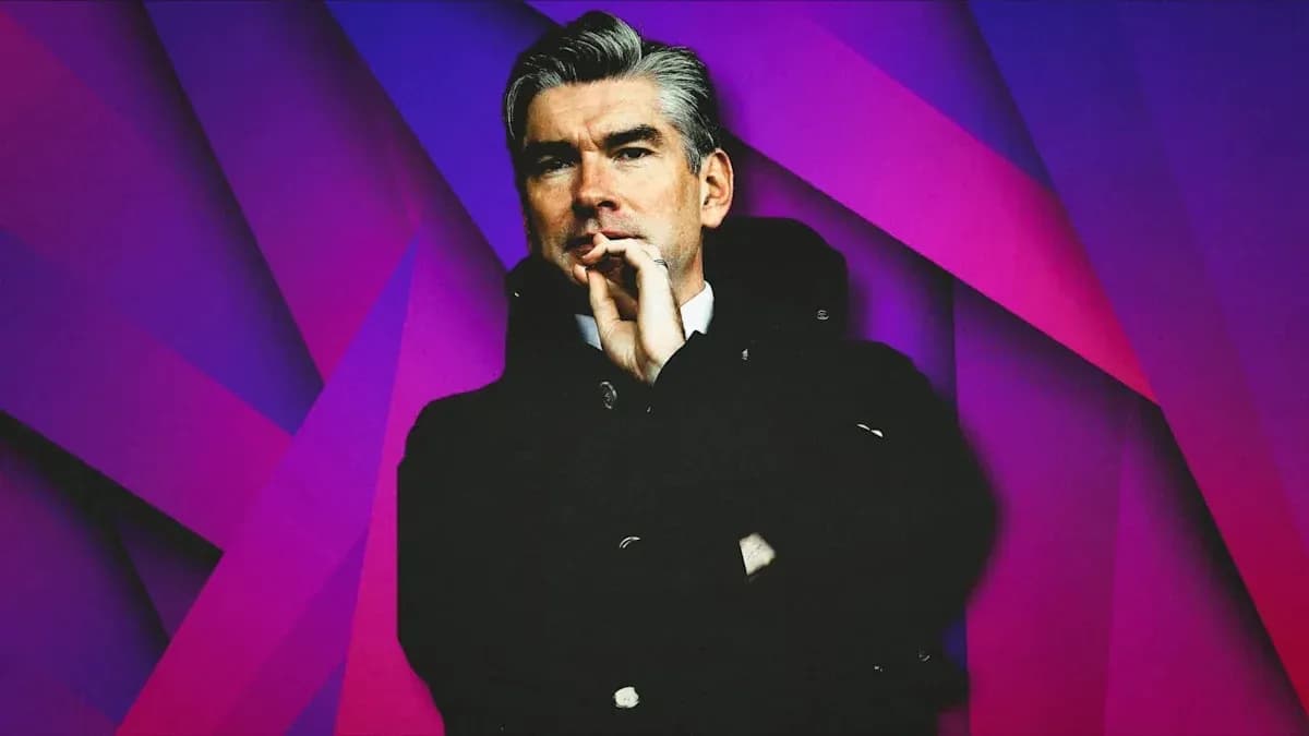 Person in dark coat against colorful background Person in dark coat against colorful background