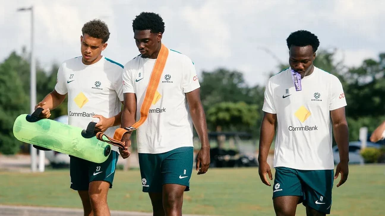 Players walking with training equipment during session Players walking with training equipment during session