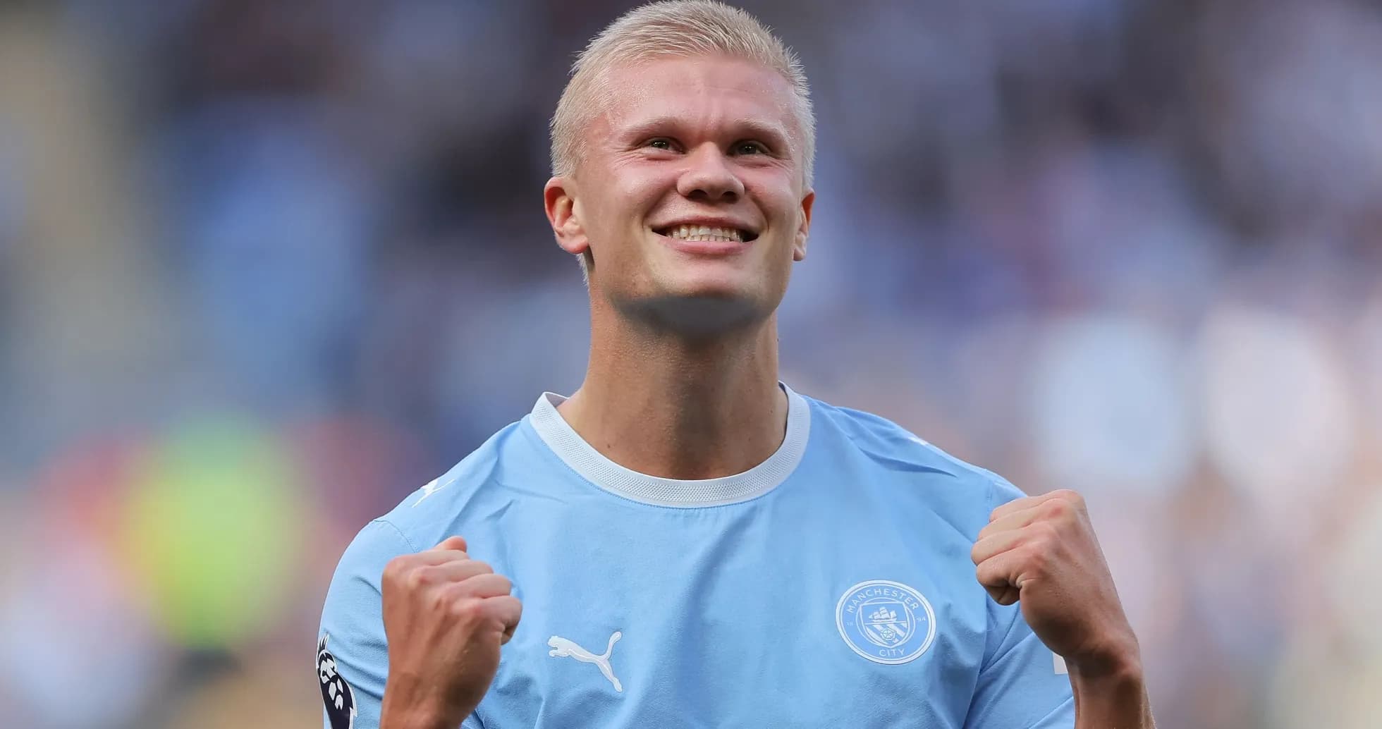 Player celebrating in Manchester City kit after match Player celebrating in Manchester City kit after match
