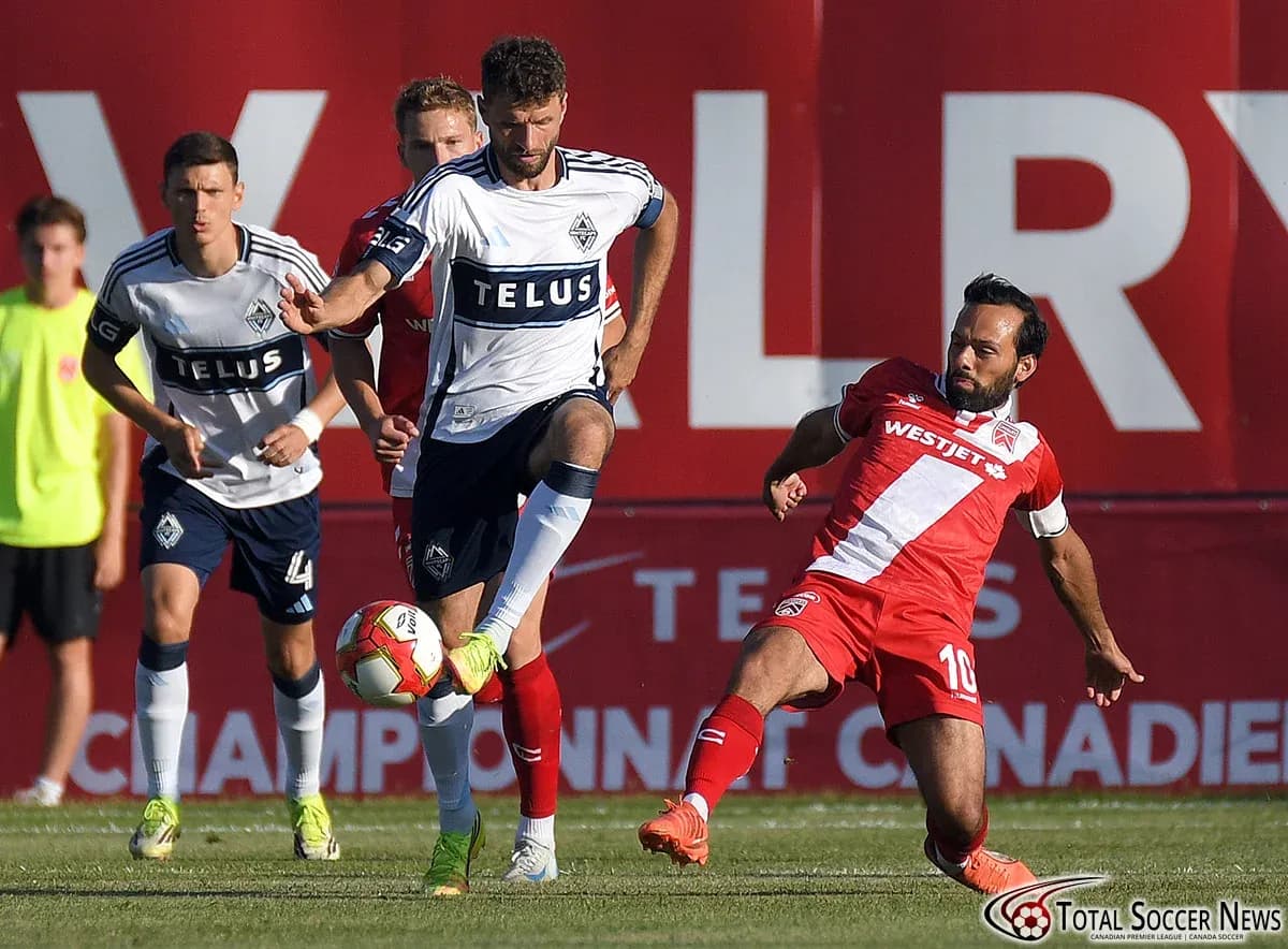 Vancouver FC player challenges Cavalry FC opponent Vancouver FC player challenges Cavalry FC opponent