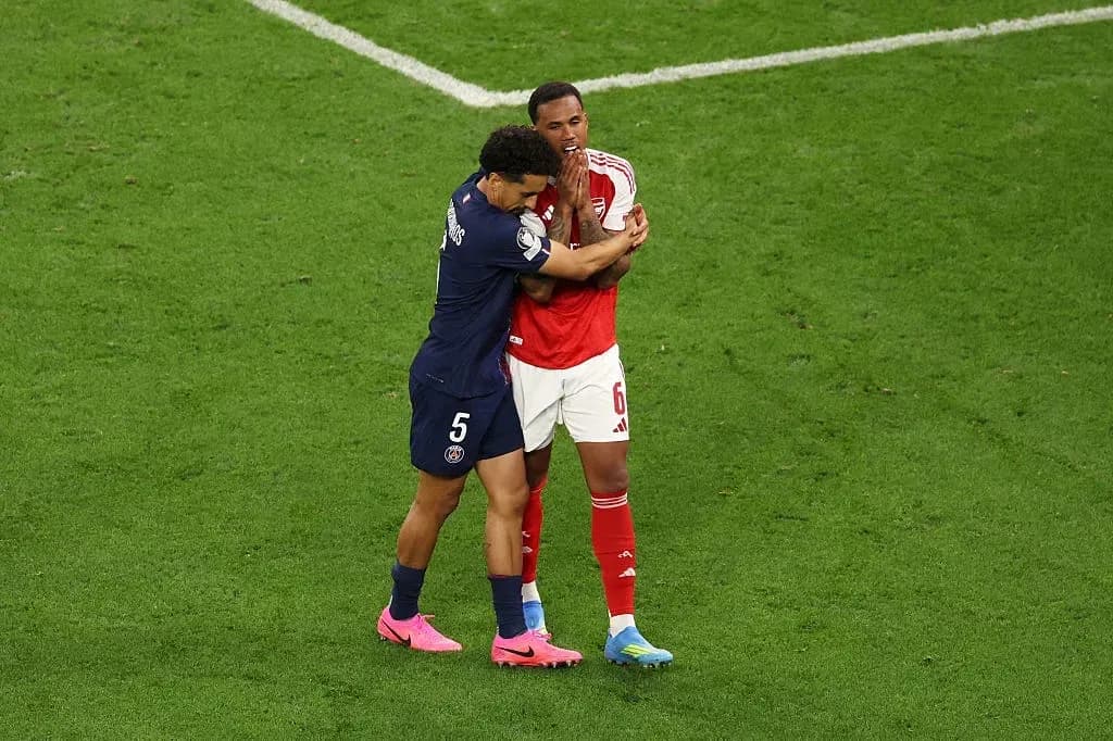 Two players embracing on the football field Two players embracing on the football field