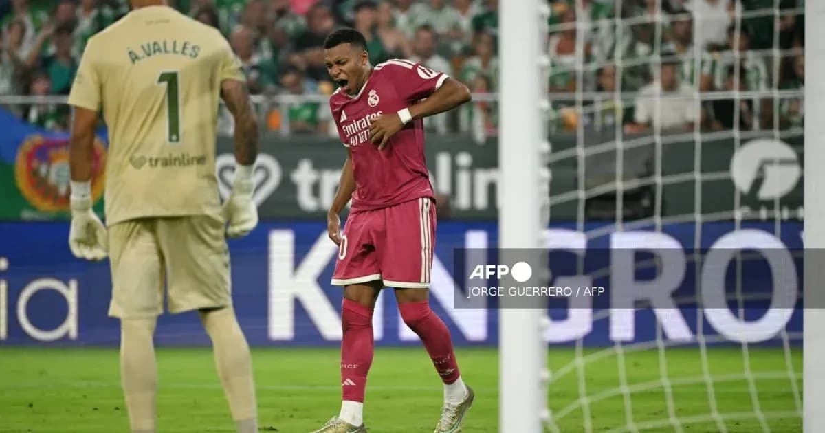 Player in red jersey celebrating a goal in match Player in red jersey celebrating a goal in match
