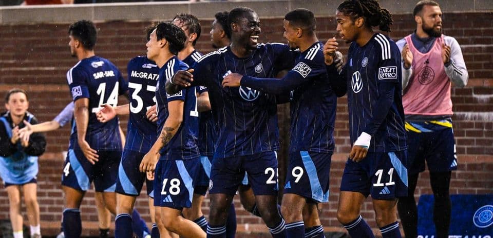 Players celebrating a goal during match Players celebrating a goal during match