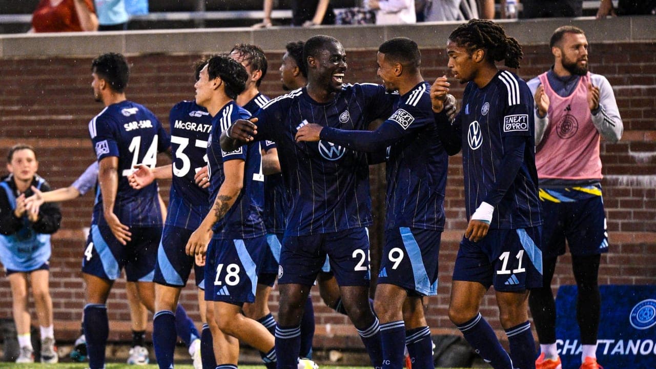 Players celebrating a goal during match Players celebrating a goal during match