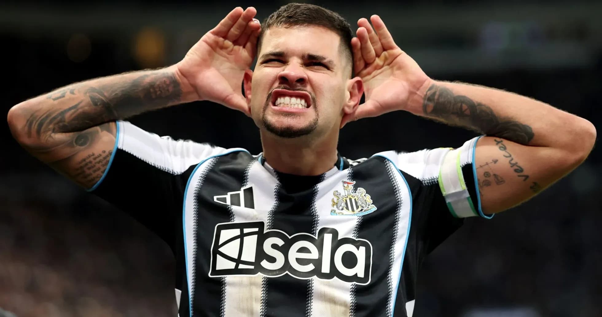 Player celebrating with hands to ears during match Player celebrating with hands to ears during match