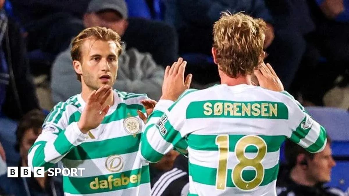 Two Celtic players celebrating on the pitch Two Celtic players celebrating on the pitch