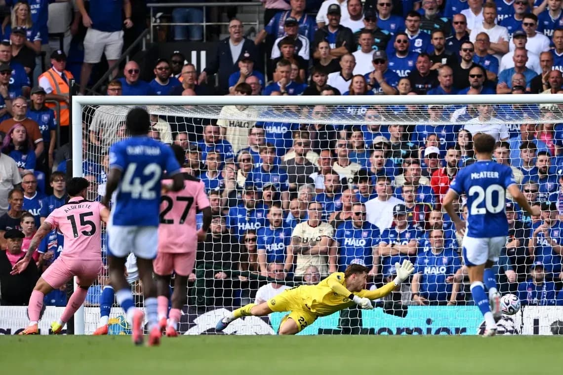Goalkeeper diving to save a penalty kick Goalkeeper diving to save a penalty kick