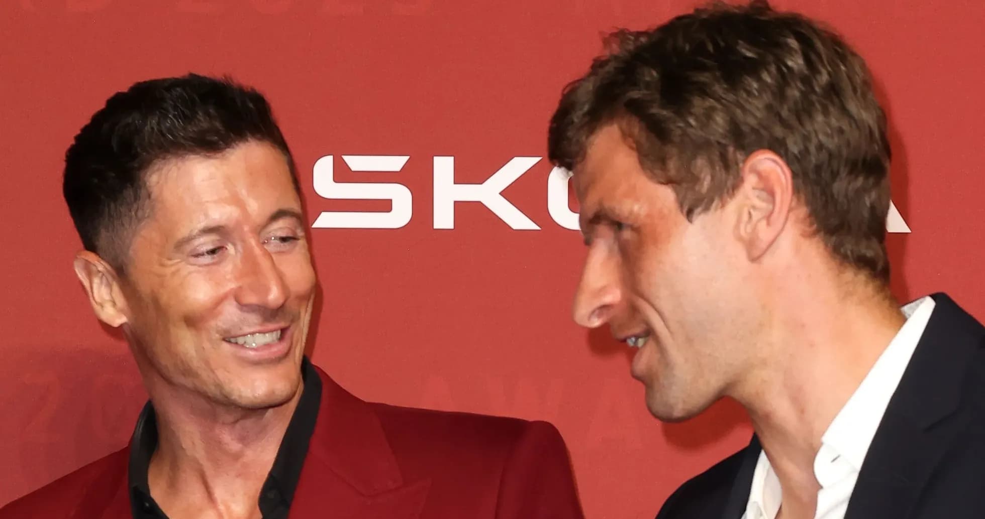Two men in conversation at an award event Two men in conversation at an award event