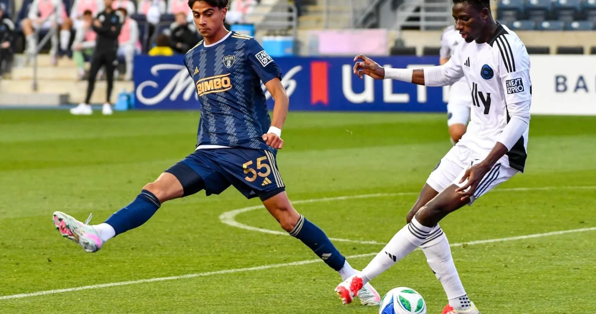 Crown Legacy player tackling Philadelphia Union II player Crown Legacy player tackling Philadelphia Union II player