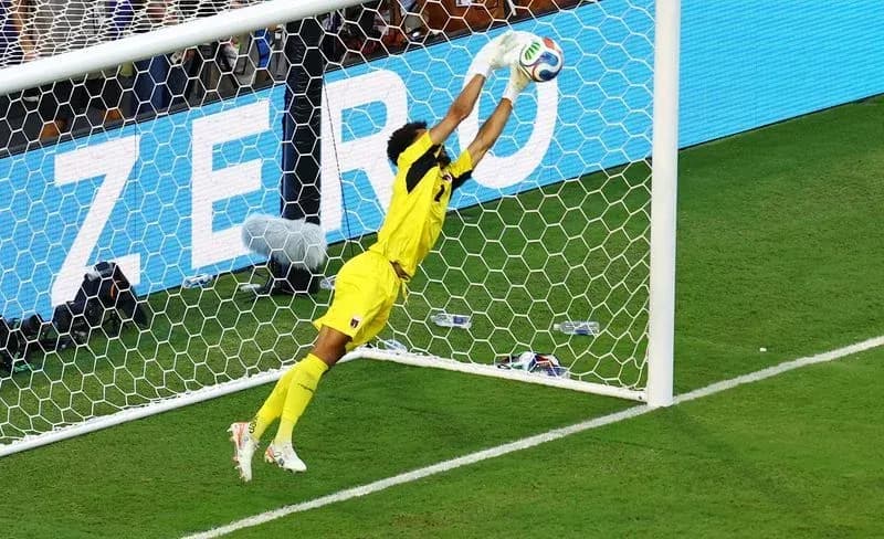 Goalkeeper diving to make a save in match Goalkeeper diving to make a save in match