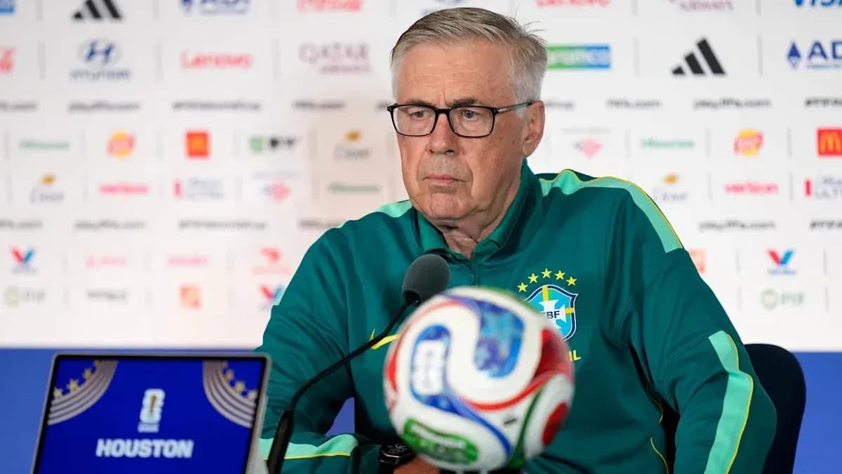 Manager at press conference with football and laptop Manager at press conference with football and laptop