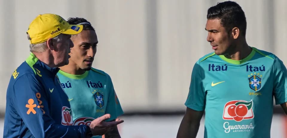 Coach discussing with two players during training session Coach discussing with two players during training session