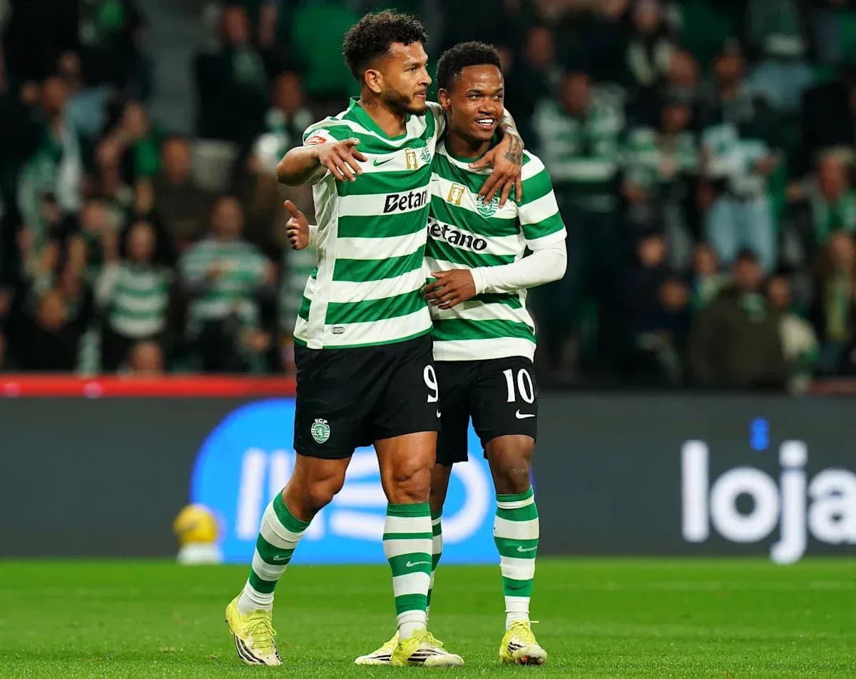 Two Sporting CP players celebrating on the pitch Two Sporting CP players celebrating on the pitch