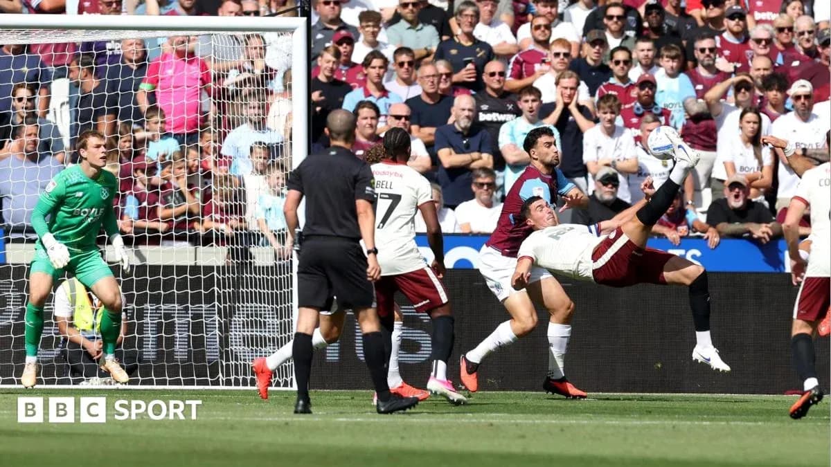 Player attempting bicycle kick in front of goal Player attempting bicycle kick in front of goal