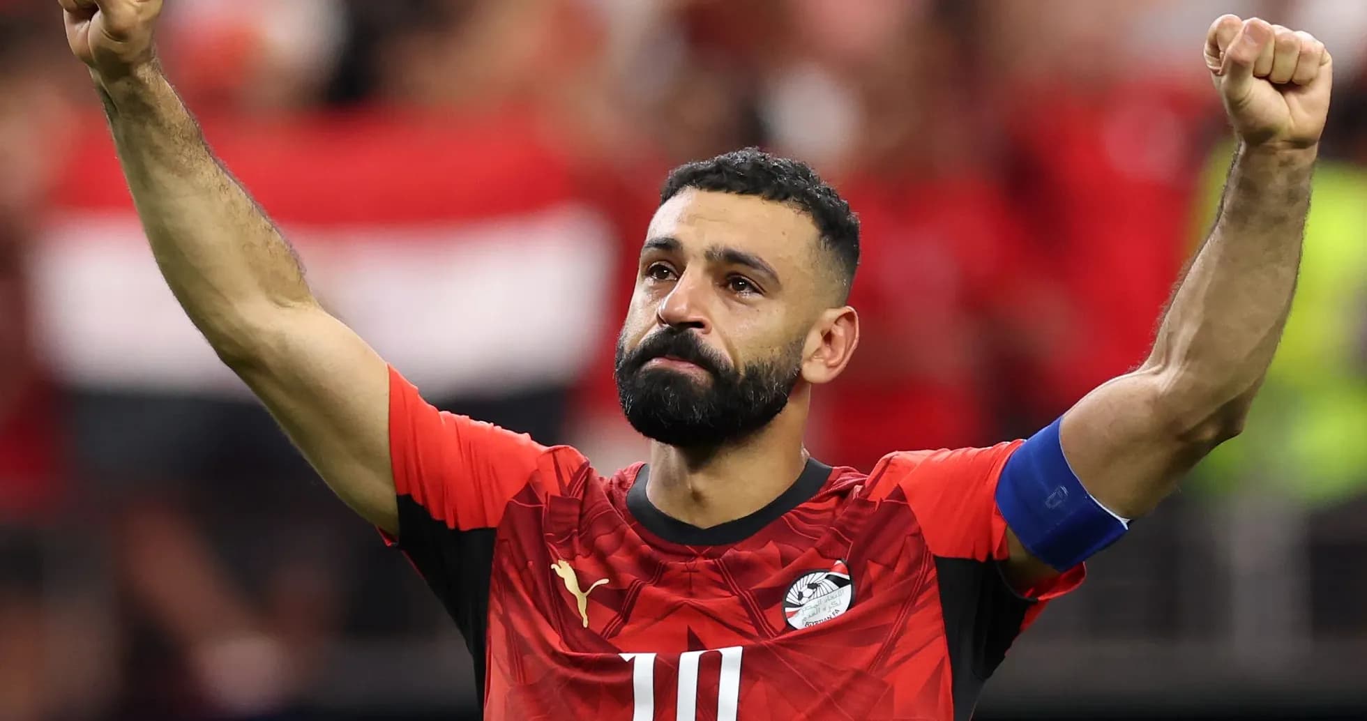 Player celebrating with raised fist during match Player celebrating with raised fist during match