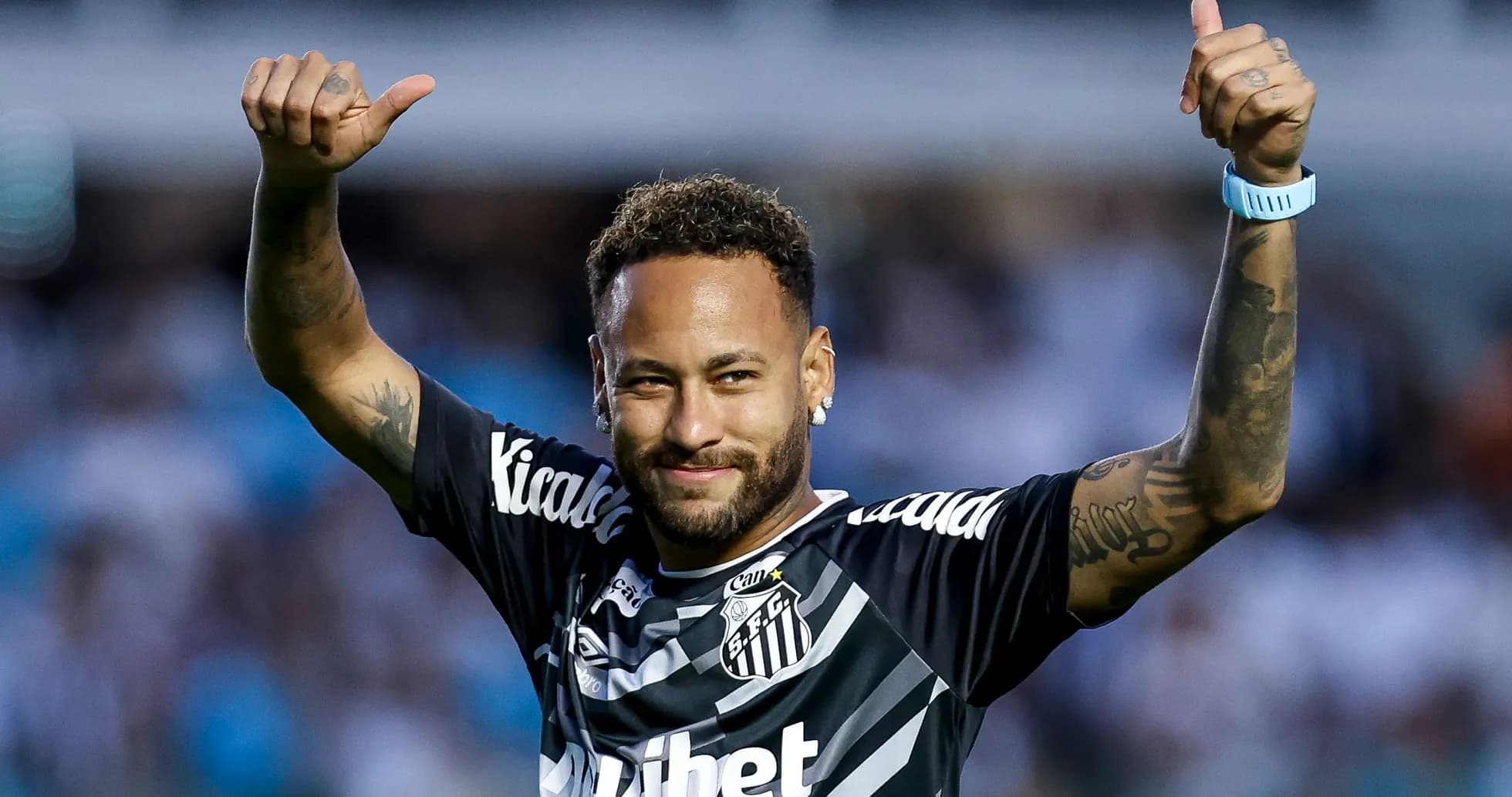 Player celebrating with thumbs up in Santos jersey Player celebrating with thumbs up in Santos jersey