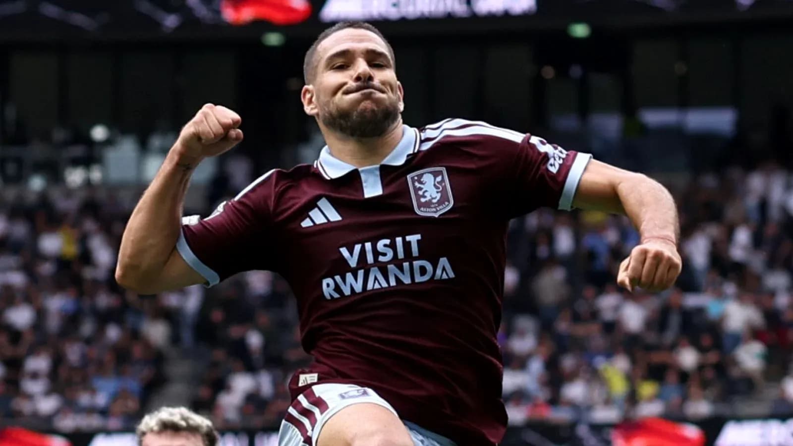 Player celebrating a goal in Aston Villa jersey Player celebrating a goal in Aston Villa jersey