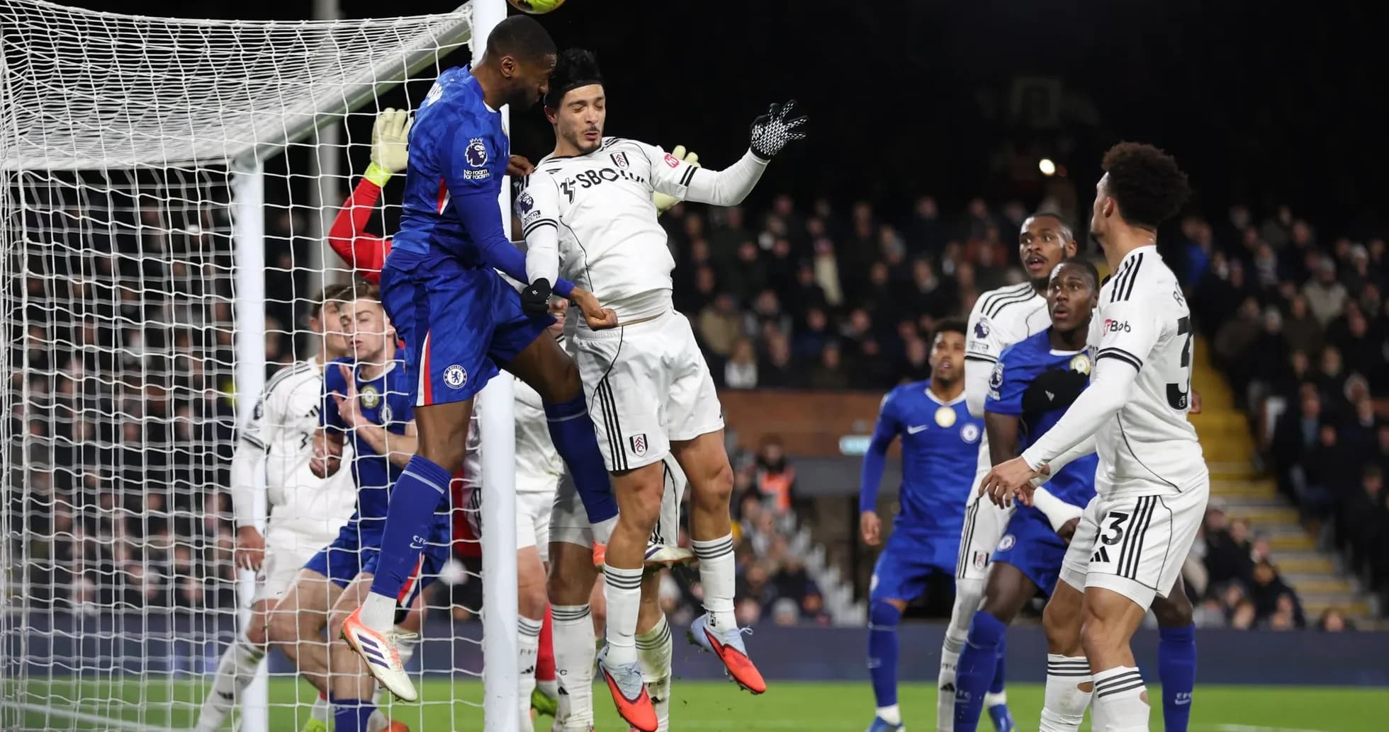Chelsea player attempting to score against Fulham Chelsea player attempting to score against Fulham