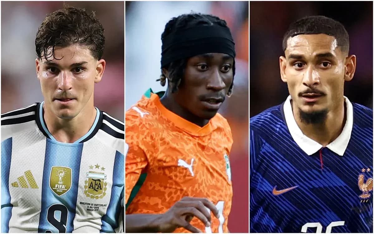 Three football players in national team jerseys Three football players in national team jerseys