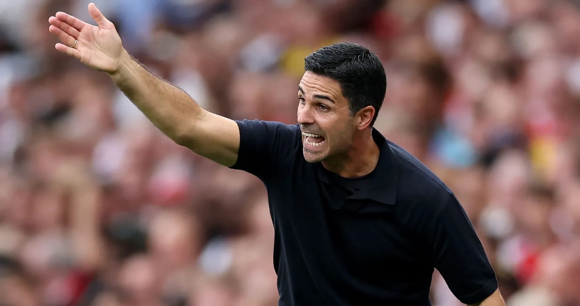 Manager gesturing during a match on the sideline Manager gesturing during a match on the sideline