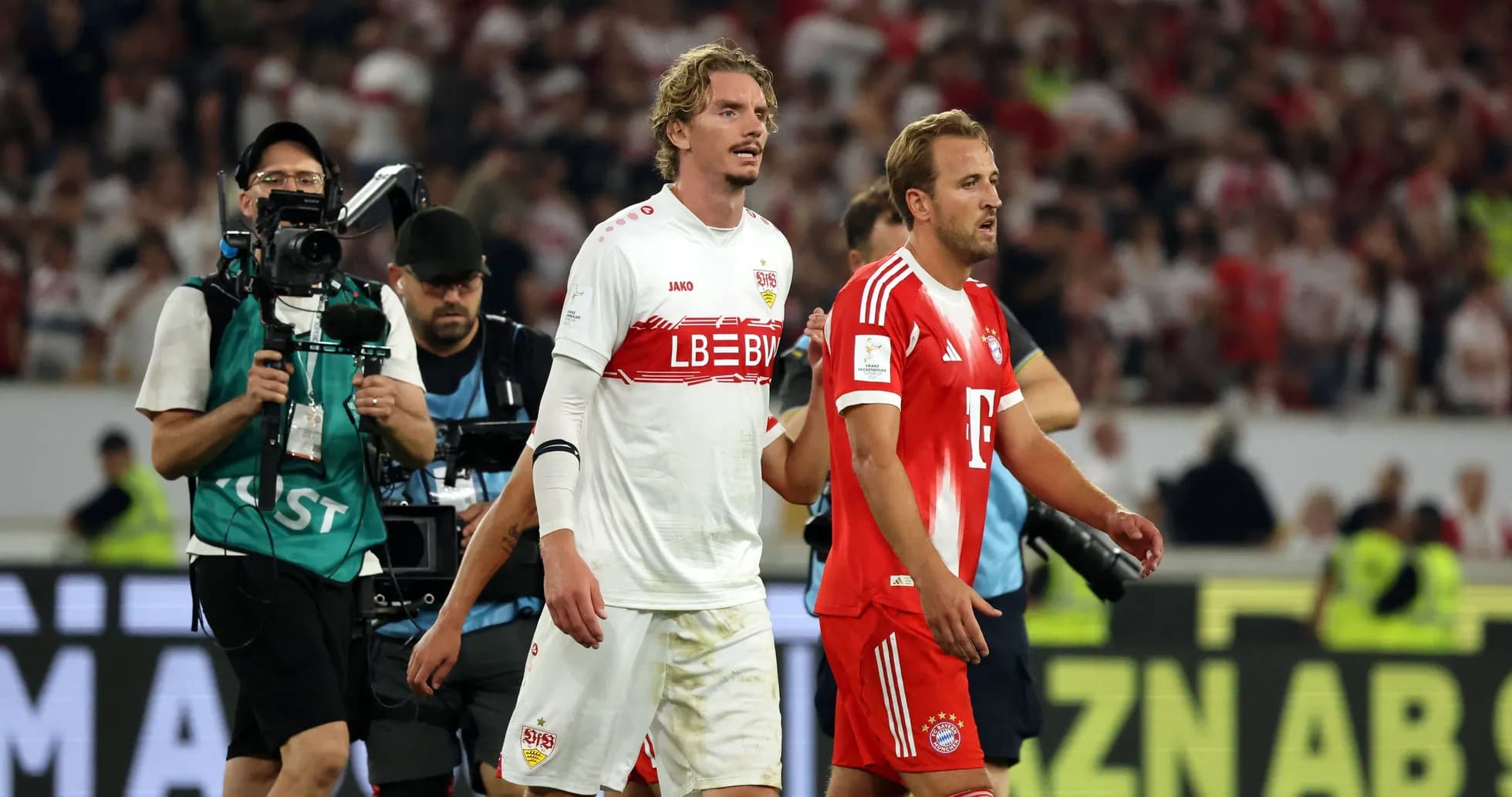 Players walking off field after match conclusion Players walking off field after match conclusion