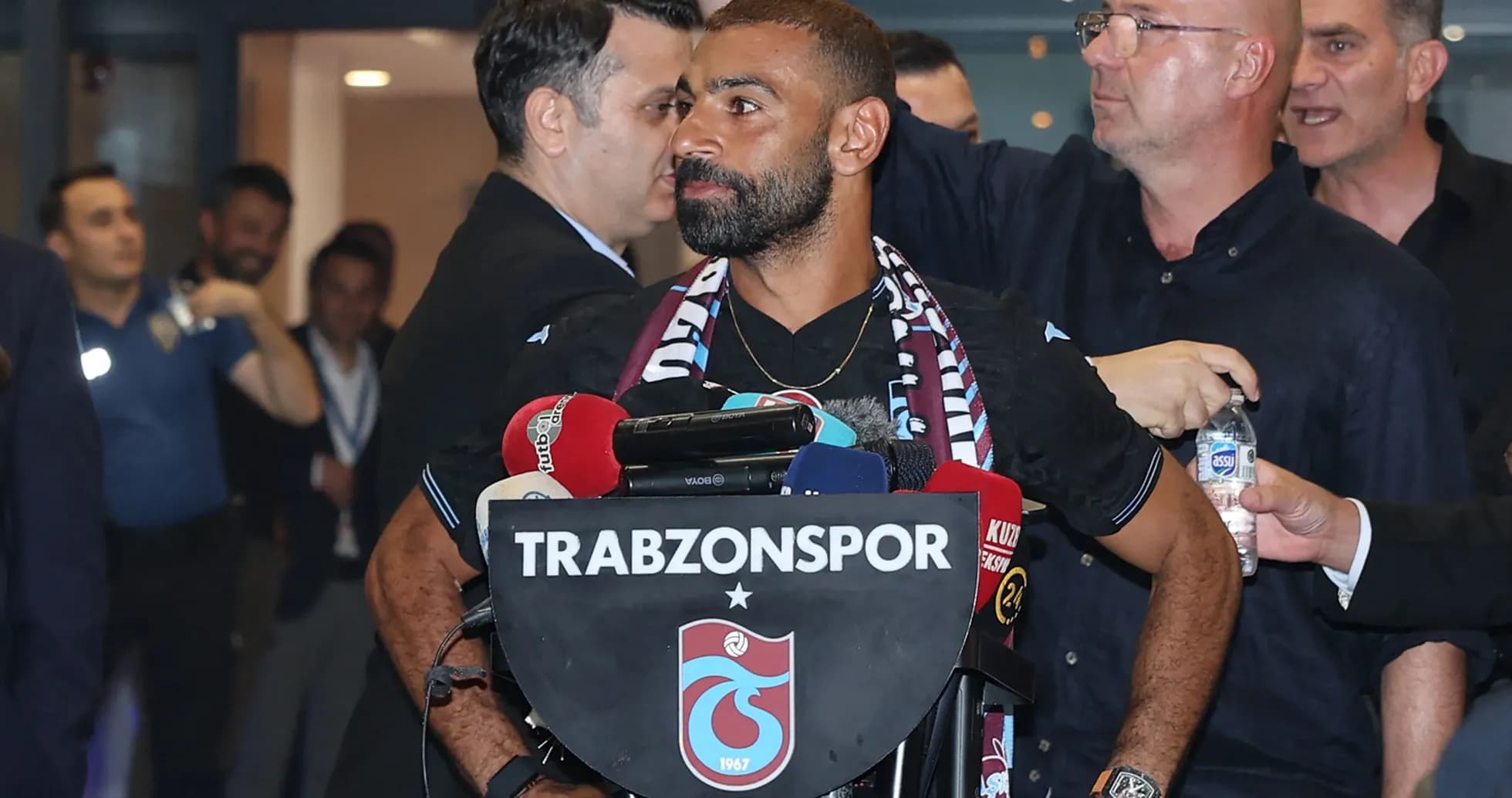Player speaking at Trabzonspor press conference podium Player speaking at Trabzonspor press conference podium