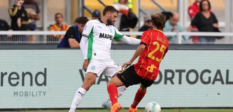 Sassuolo player challenging Lecce opponent for the ball Sassuolo player challenging Lecce opponent for the ball