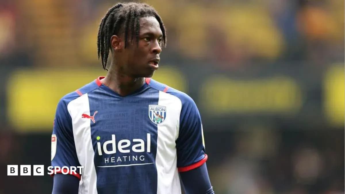 Player wearing West Bromwich Albion kit on field Player wearing West Bromwich Albion kit on field