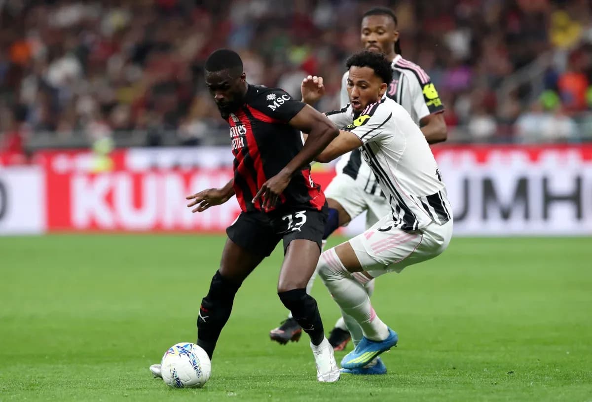 AC Milan and Juventus players battling for possession AC Milan and Juventus players battling for possession