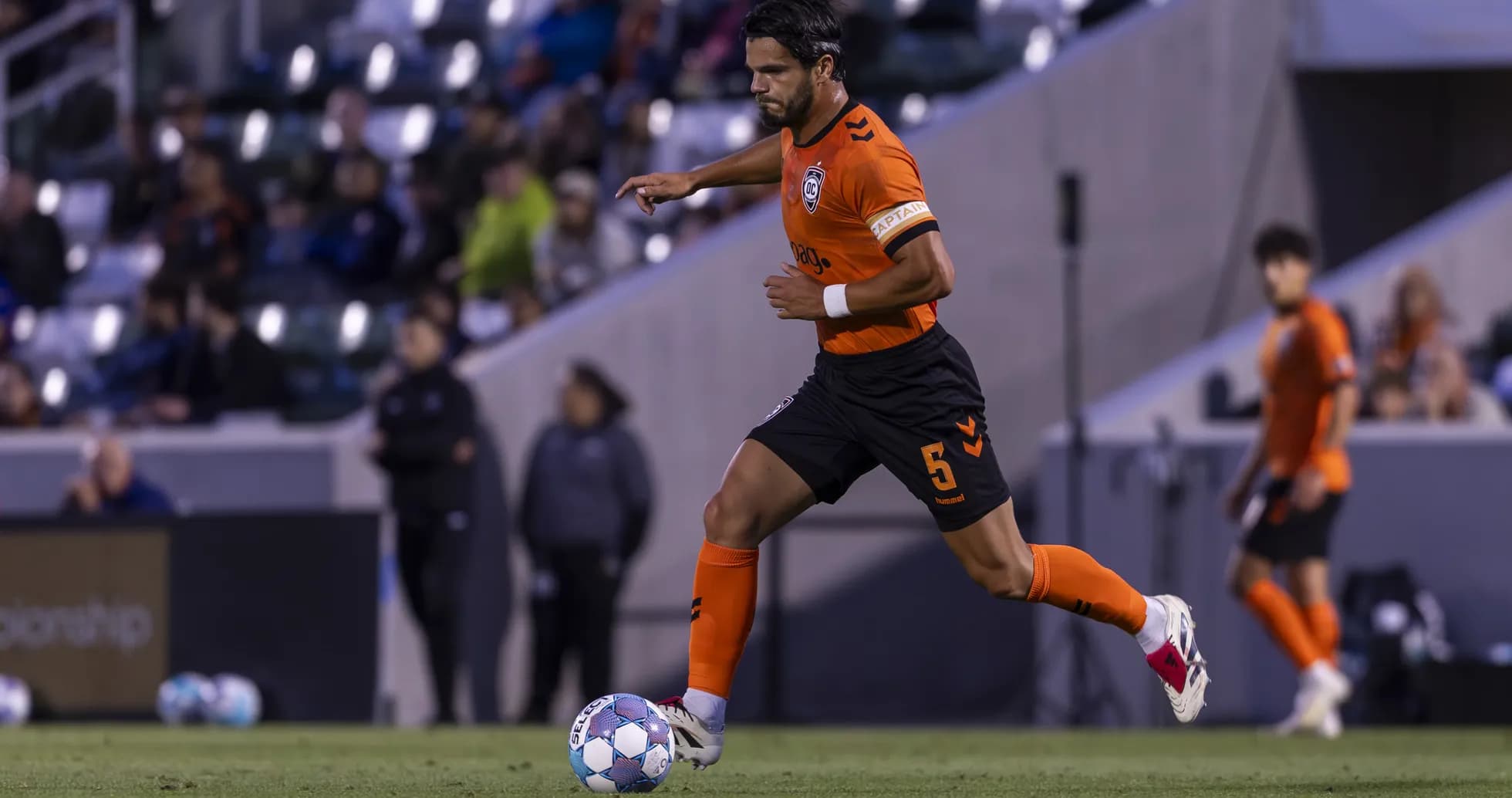 Player dribbling ball during New Mexico United match Player dribbling ball during New Mexico United match