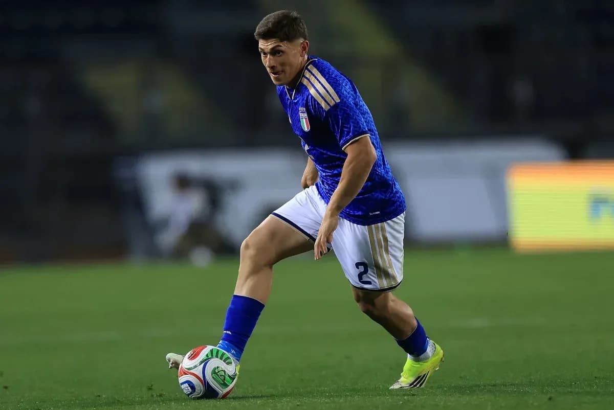 Player dribbling the ball during a match Player dribbling the ball during a match