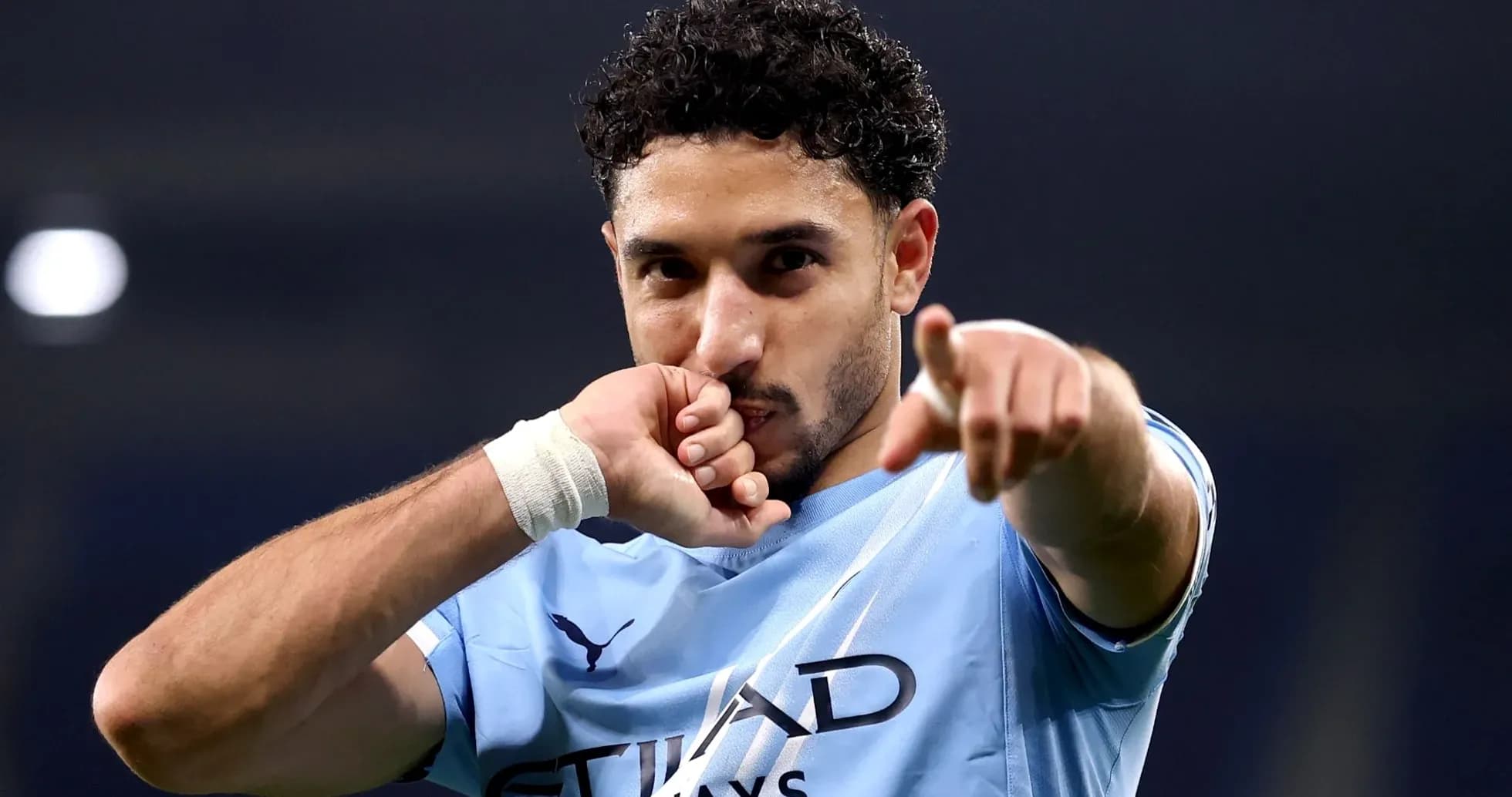 Player celebrating and pointing during match Player celebrating and pointing during match