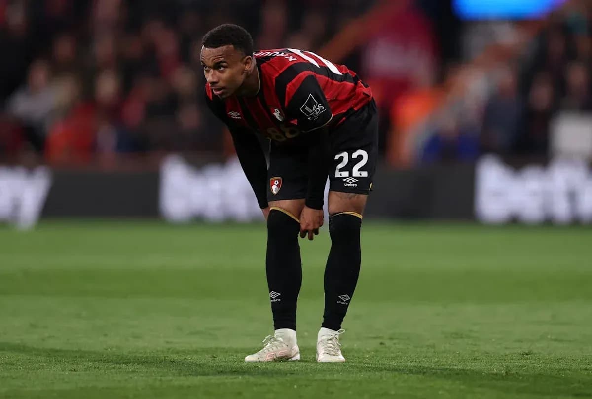 Bournemouth player bending over on the pitch Bournemouth player bending over on the pitch