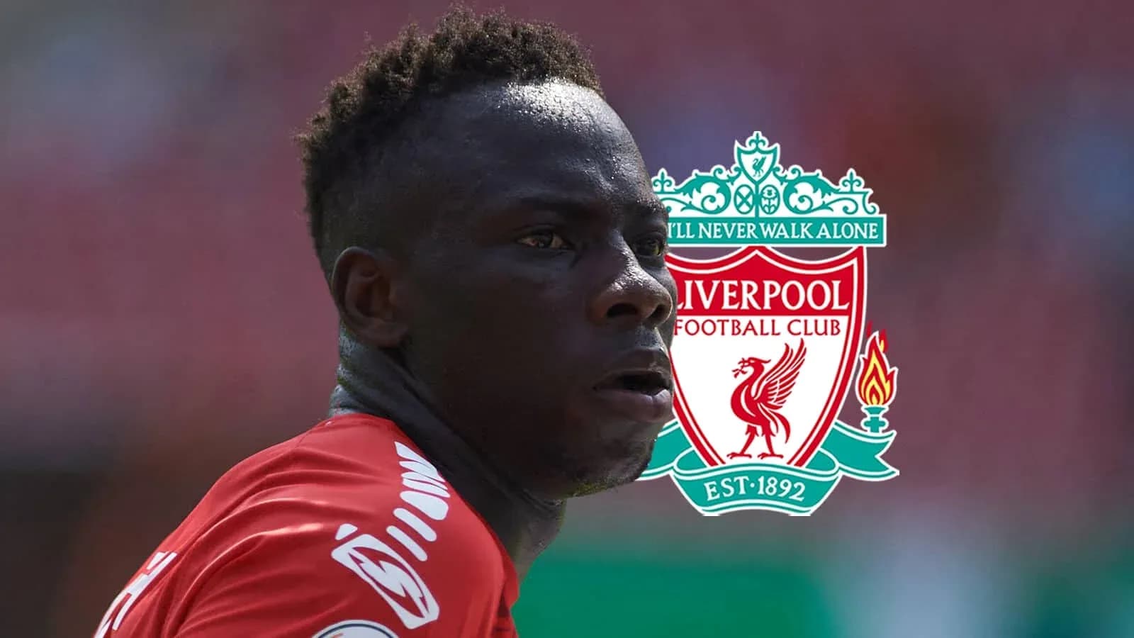 Player in red jersey with Liverpool FC logo background Player in red jersey with Liverpool FC logo background