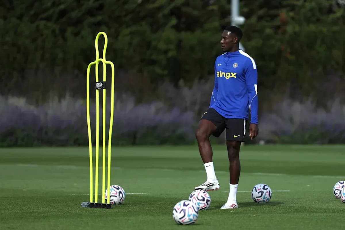 Player practicing dribbling around training cones Player practicing dribbling around training cones