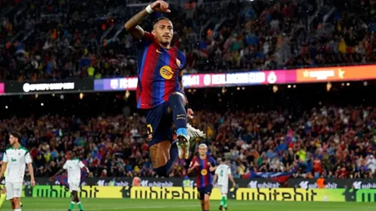 Player celebrating a goal at Camp Nou stadium Player celebrating a goal at Camp Nou stadium