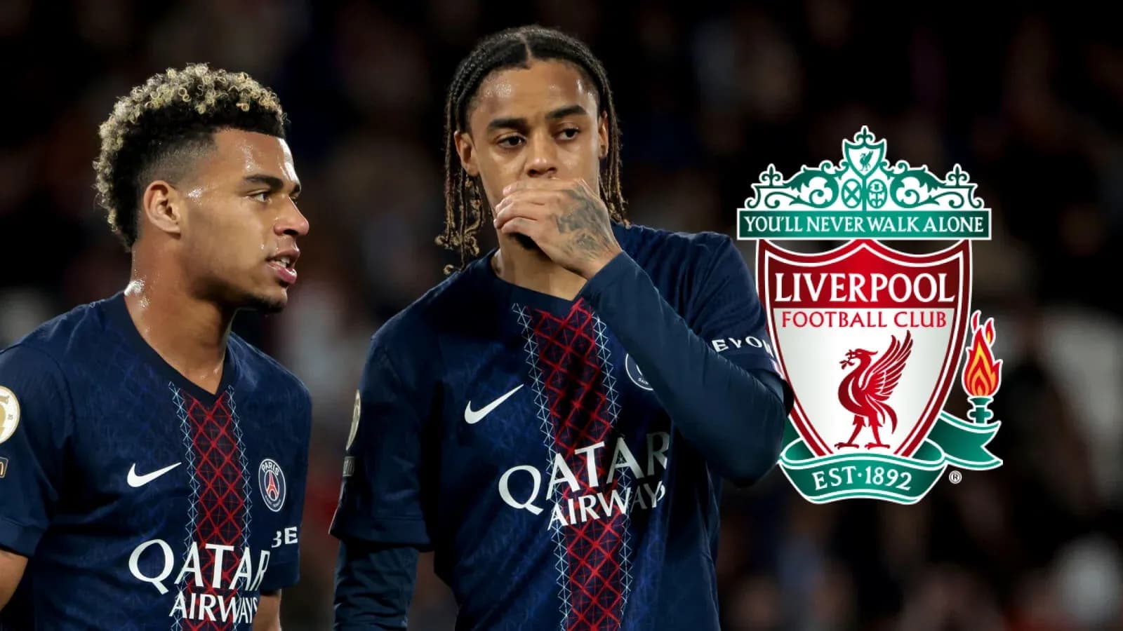 Two players in PSG jerseys discussing on the field Two players in PSG jerseys discussing on the field